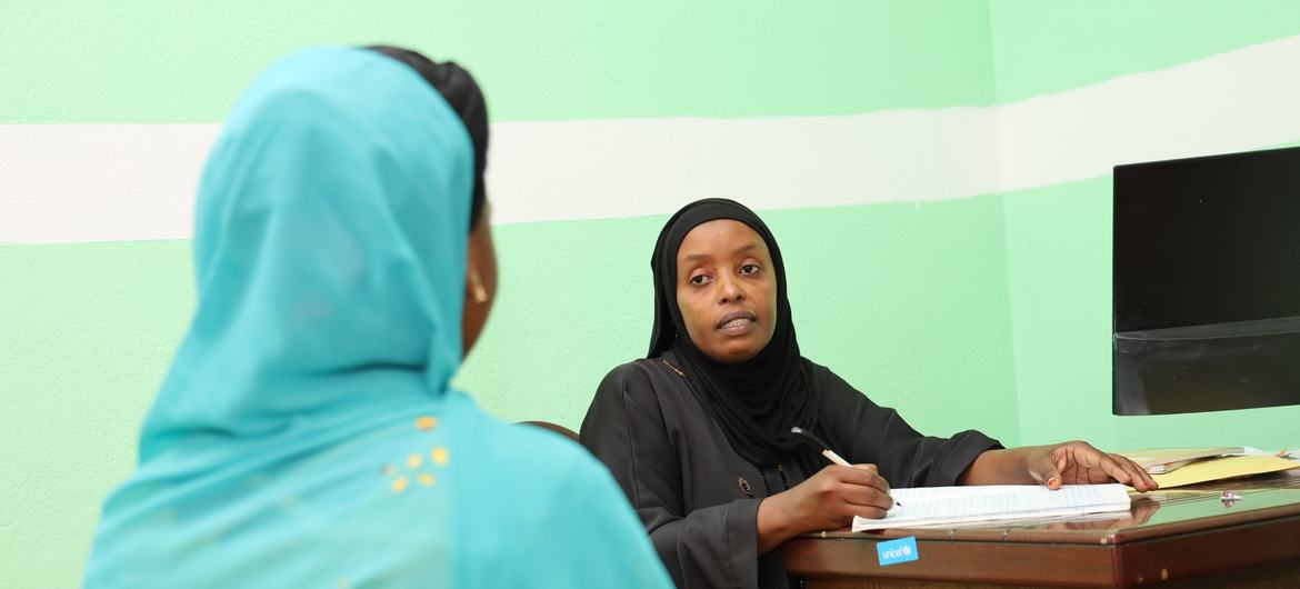 A counselor at the Listening and Advocacy Service for Children and Women Victims of Violence speaks to a victim of sexual violence in Moroni, the capital of The Comoros.